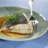 Roast turbot with slightly spicy-hot tuber purée and acidulated wild-mushroom stock 
