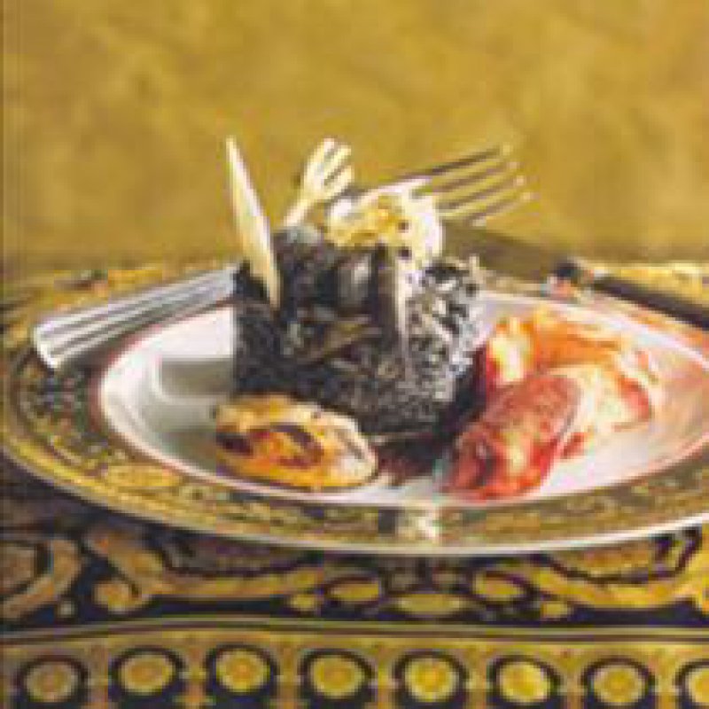 BLACK RISOTTO WITH TRUFFLES AND LEAVES OF GOLD, LOBSTER AND COCKLES