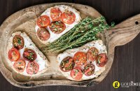 Bruschetta with tomatoes,thyme and xino-myzithra  traditional unpasteurised Greek cheese